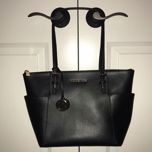 Black leather MICHAEL KORS handbag.